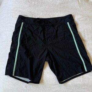 Travis Mathew Black Board Shorts with Aqua Stripes
